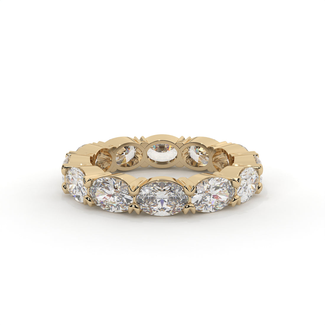 Gold ring with embedded diamonds on a white background