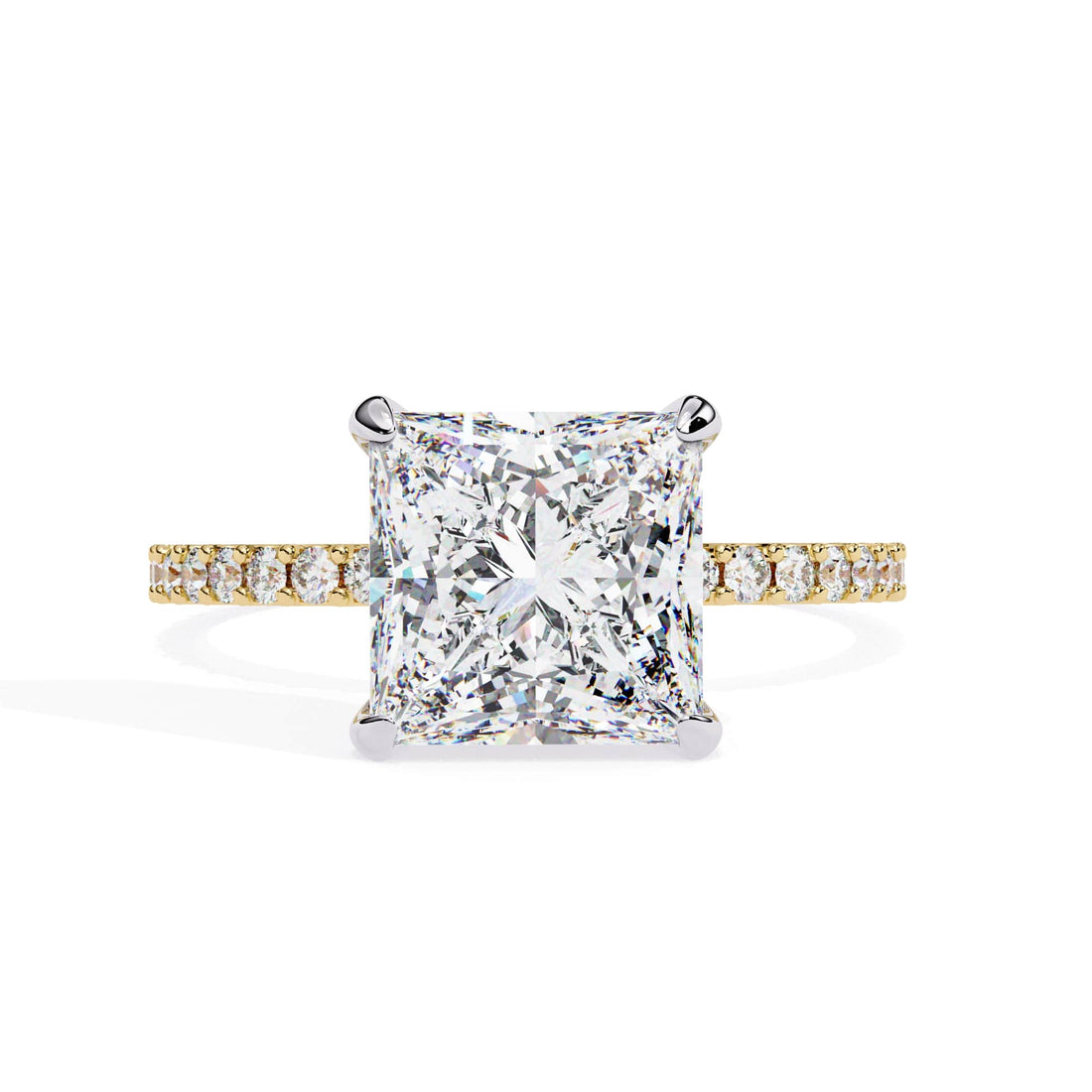 Diamond ring with a yellow gold band on a white background