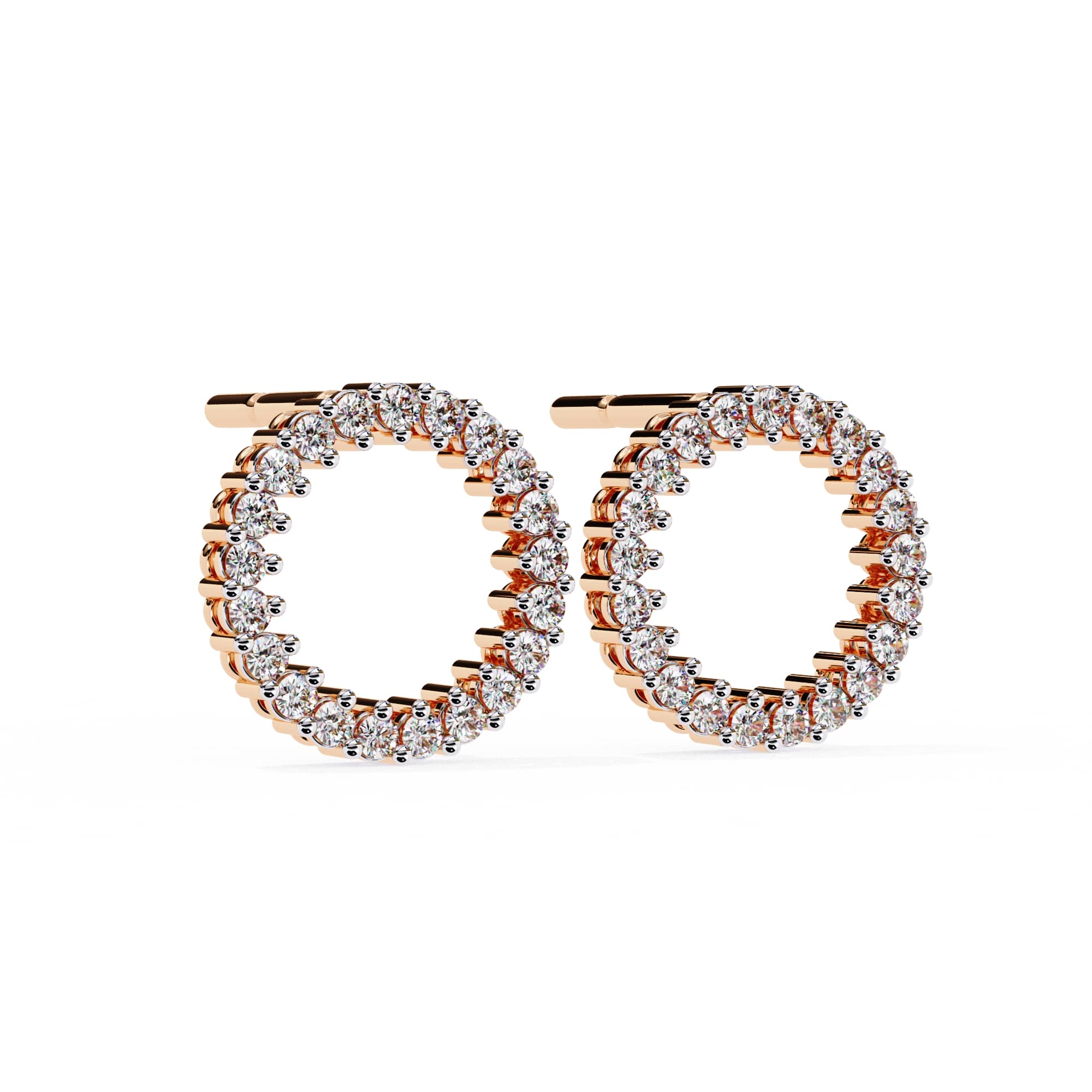 Rose gold hoop earrings with clear gemstones on a white background