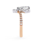 Diamond ring with a rose gold band on a white background