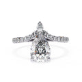 Diamond ring with pear-shaped center stone on a white background