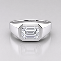 1.50 ct emerald cut lab grown diamond engagement ring with a polished bezel setting and wide band for men.
