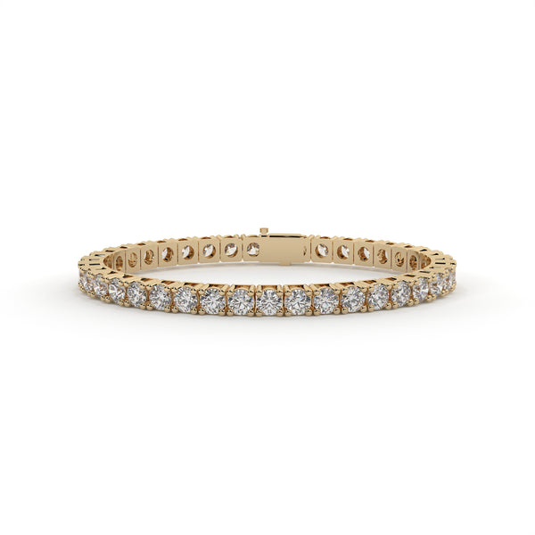 Gold bracelet with diamonds on a white background
