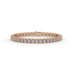 Rose gold bracelet with diamonds on a white background