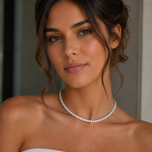 Woman wearing a diamond necklace with a neutral background
