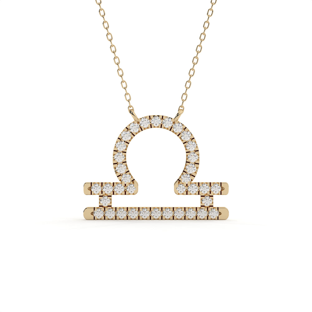 1 carat round cut lab grown diamond Libra zodiac sign pendant in yellow gold with a matching gold chain.