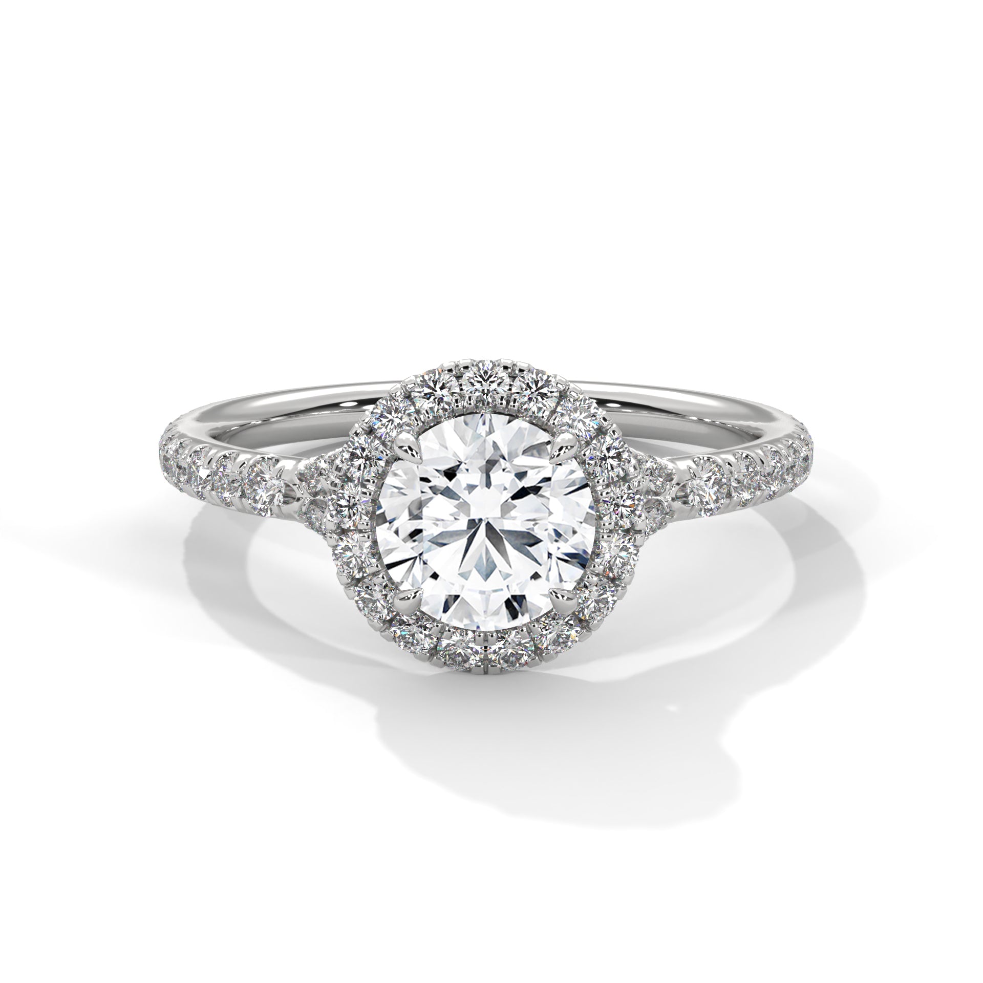 Diamond ring with a halo of smaller diamonds on a white background