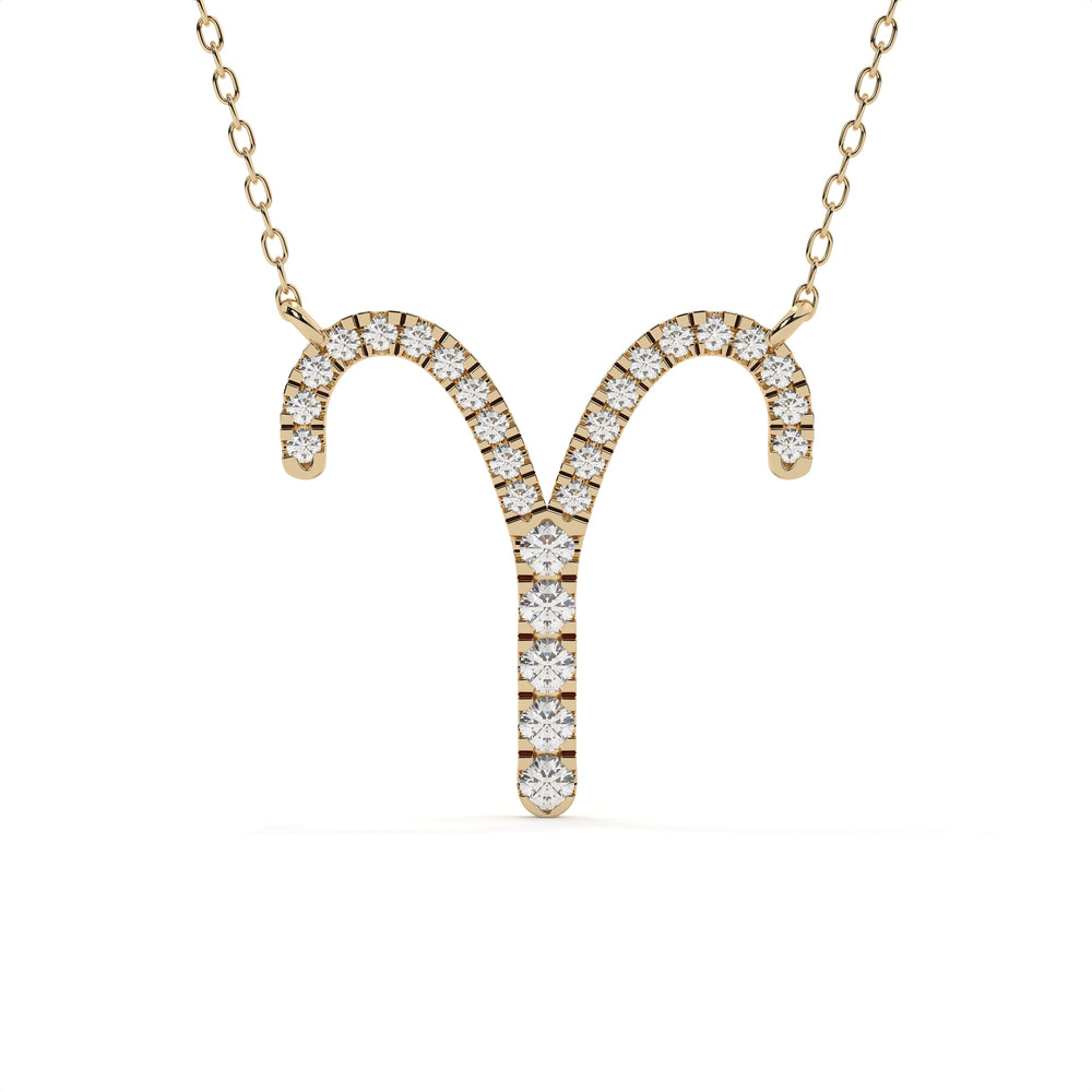 Gold necklace with zodiac sign pendant on a white background