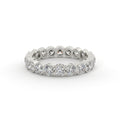 Silver ring with round diamonds on a white background