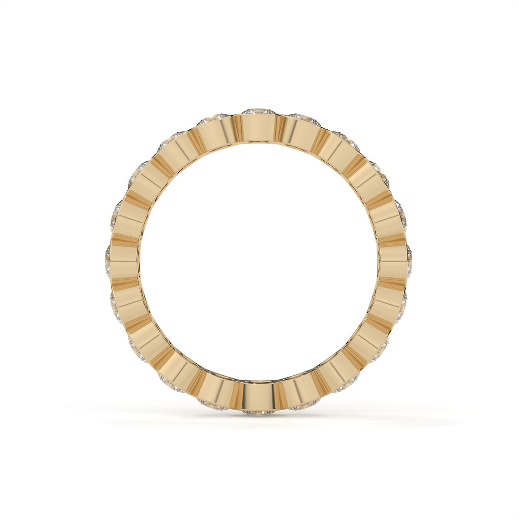 Gold ring with a textured band on a white background