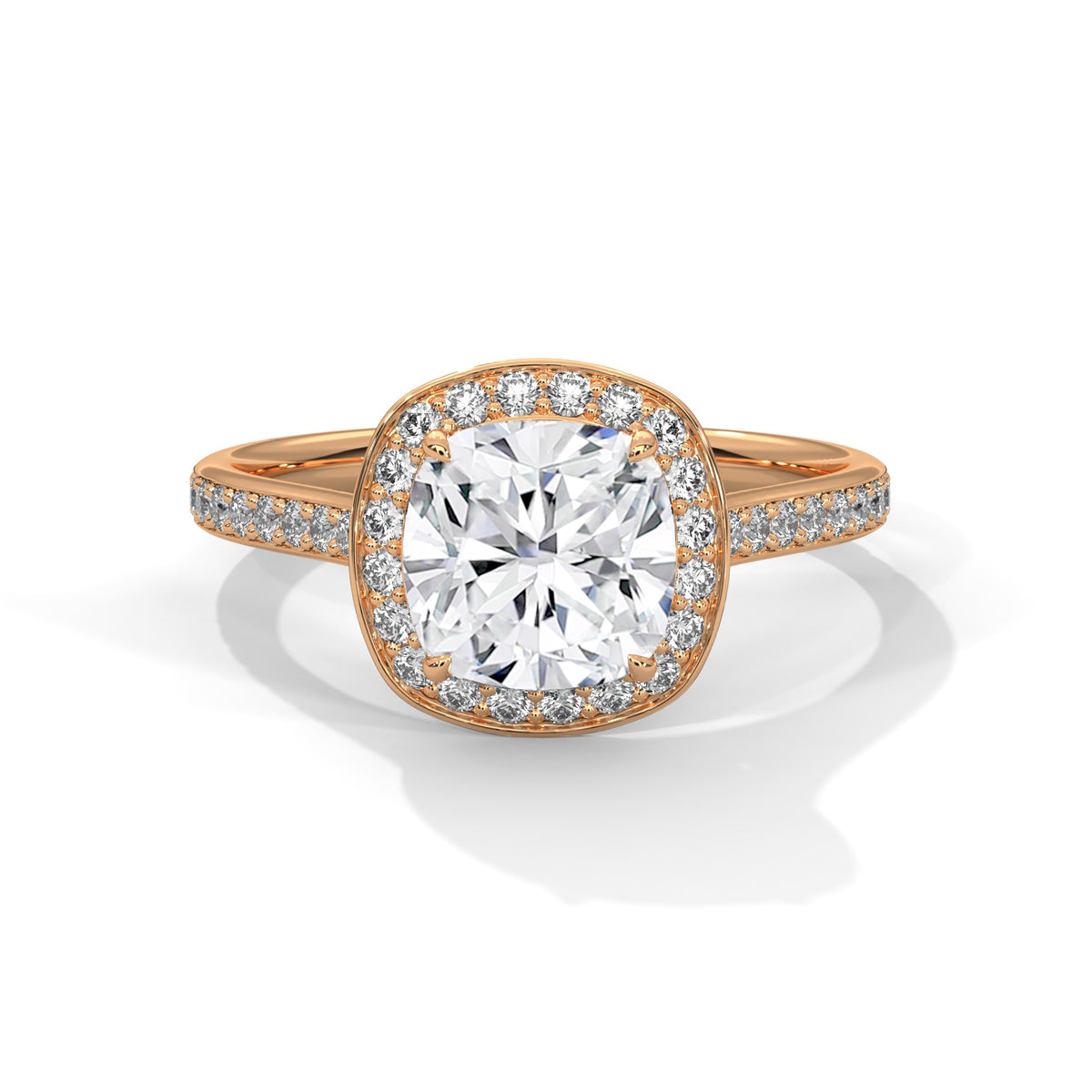 Cushion cut diamond halo engagement ring in rose gold with a pavé diamond band, shown in a front product view.