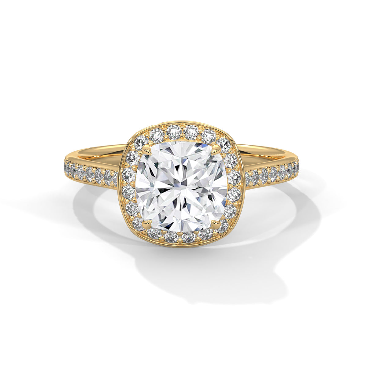 Cushion cut diamond halo engagement ring in yellow gold with a pave diamond band, shown in a front product view.