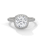 Cushion cut diamond halo engagement ring in white gold with a pave diamond band, shown in a front product view.
