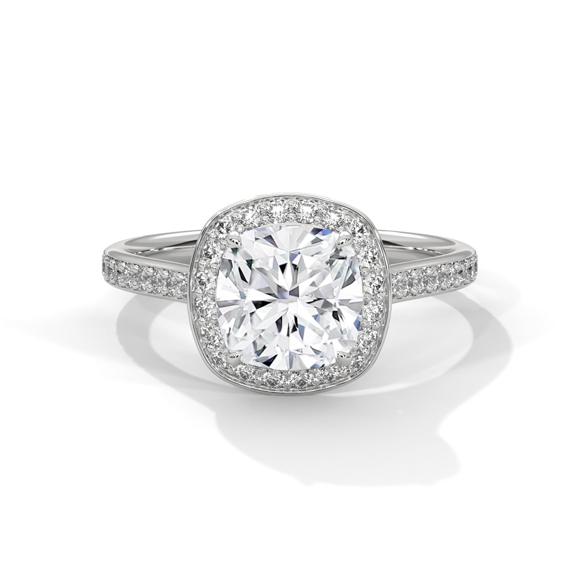 Cushion cut diamond halo engagement ring in white gold with a pave diamond band, shown in a front product view.