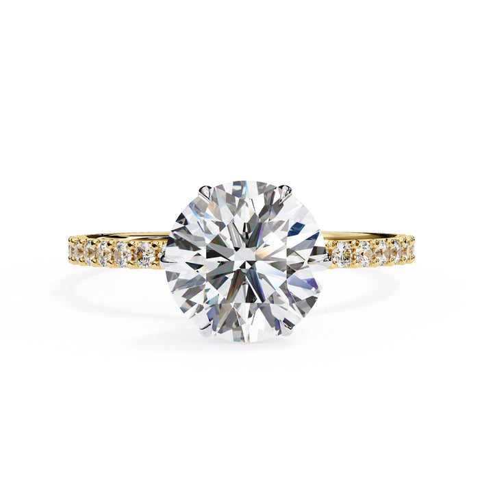 Diamond ring with gold band on a white background
