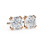 Rose gold diamond stud earrings on a white background