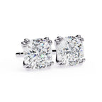 Pair of diamond stud earrings on a white background