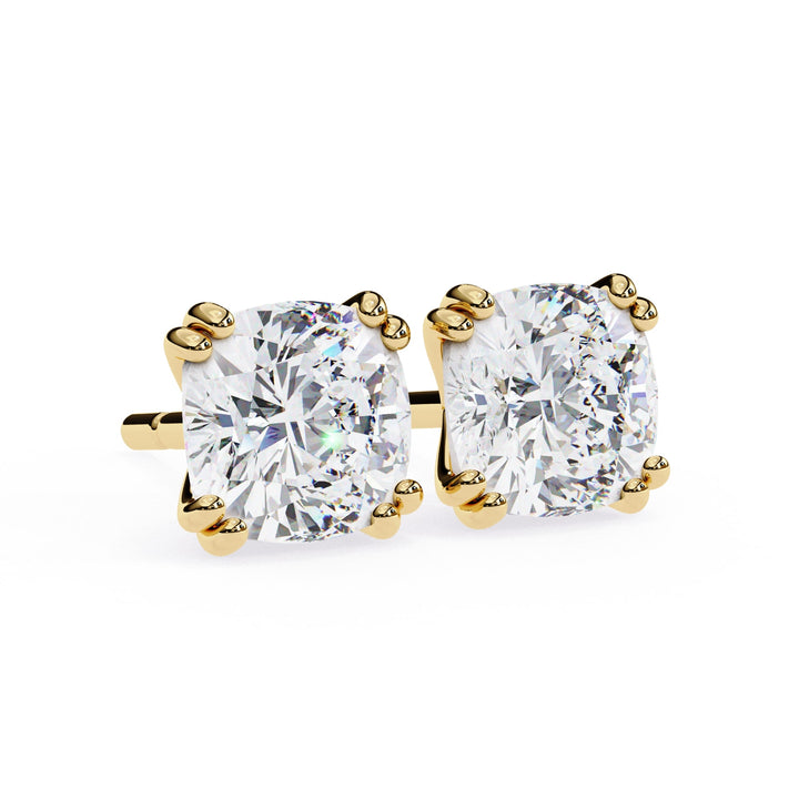 Gold stud earrings with clear Lab diamond on a white background