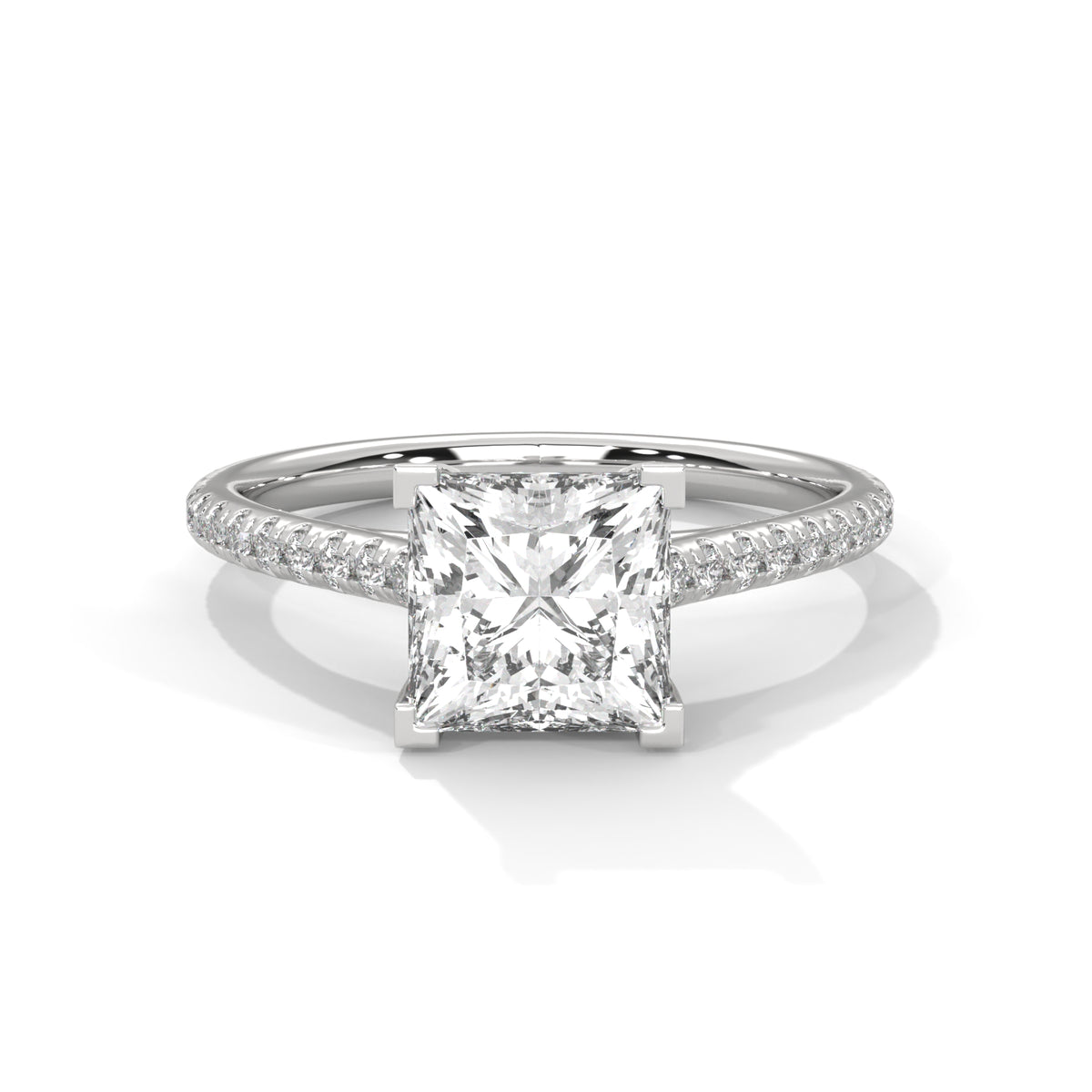 Princess cut diamond engagement ring in white gold with a pavé diamond band and four-prong setting, shown in a front product view.