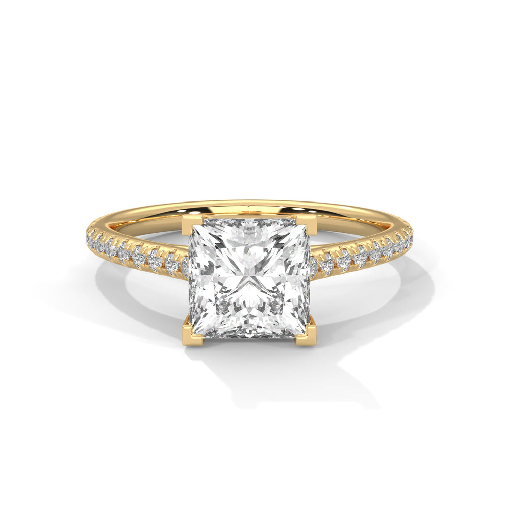 Princess cut diamond engagement ring in yellow gold with a pavé diamond band and four-prong setting, shown in a front product view.