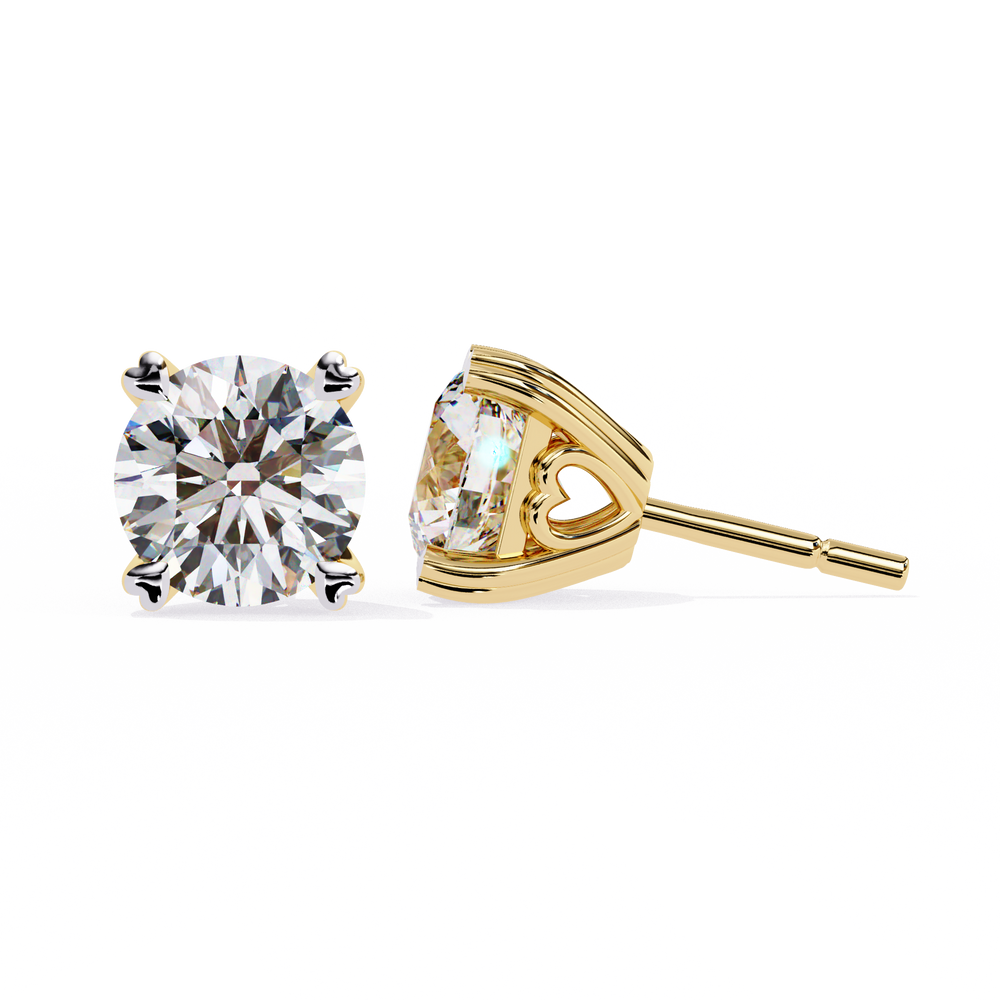 Gold stud earrings with clear gemstones on a white background