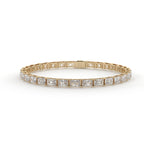 Gold bracelet with square-cut diamonds on a white background