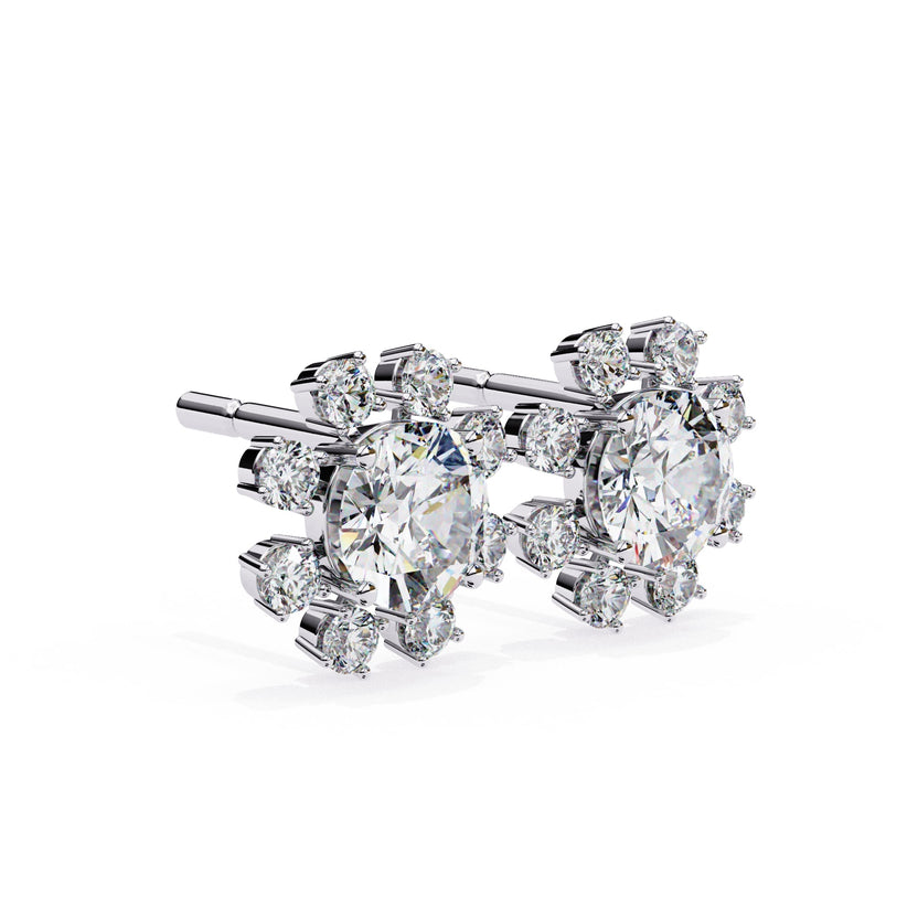 Round cut diamond flower style earrings in white gold metal and secure back style.