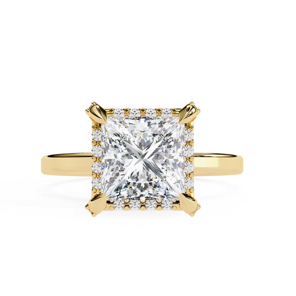 Gold ring with a large diamond on a white background