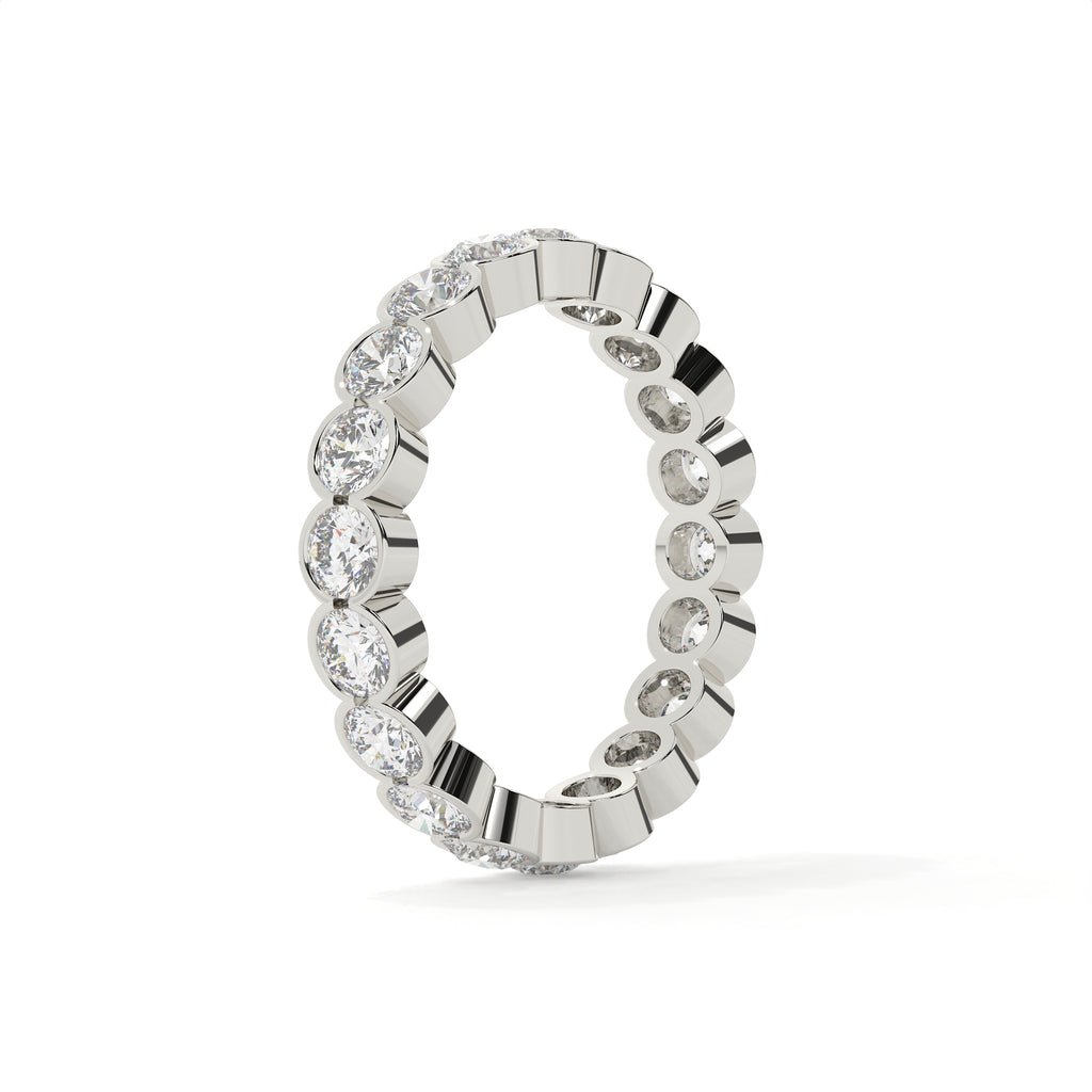 Silver ring with diamond accents on a white background