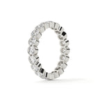 Silver ring with diamond accents on a white background