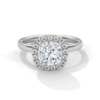Cushion cut diamond halo engagement ring in white gold with a plain band, shown in a front product view.