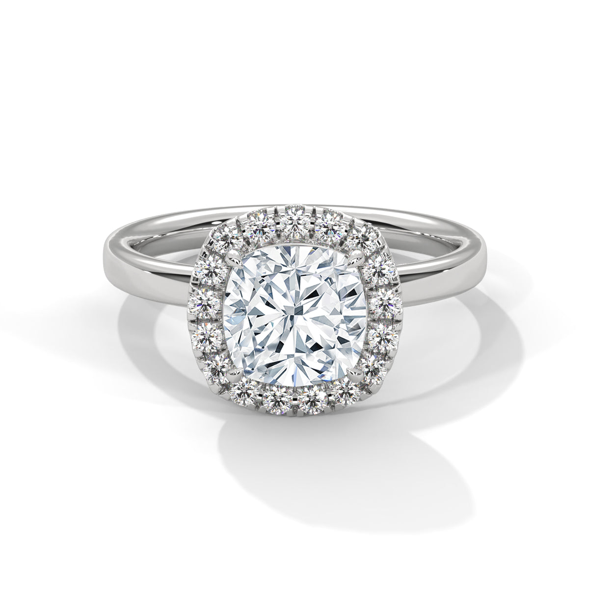 Cushion cut diamond halo engagement ring in white gold with a plain band, shown in a front product view.