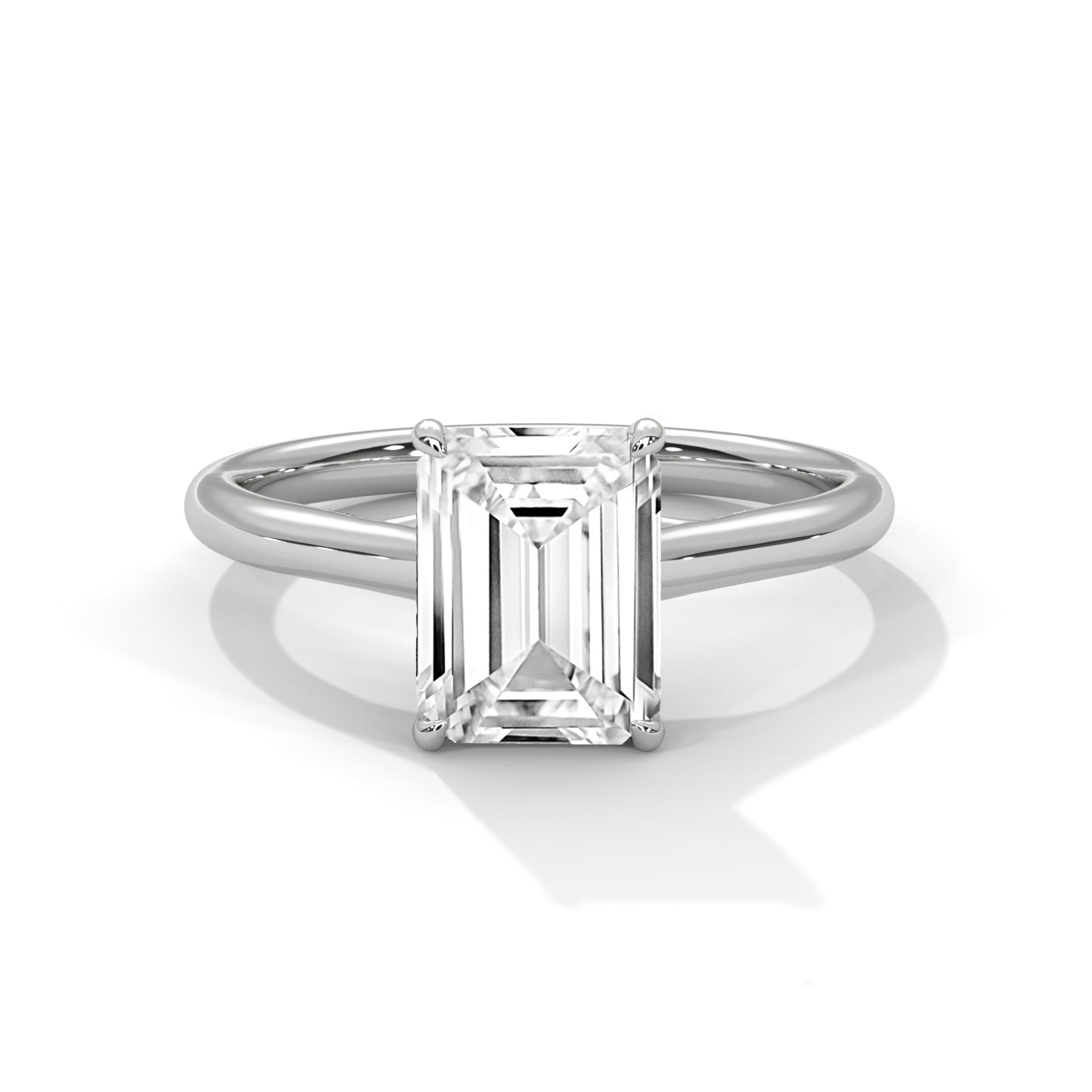 Diamond ring with emerald-cut gemstone on a white background