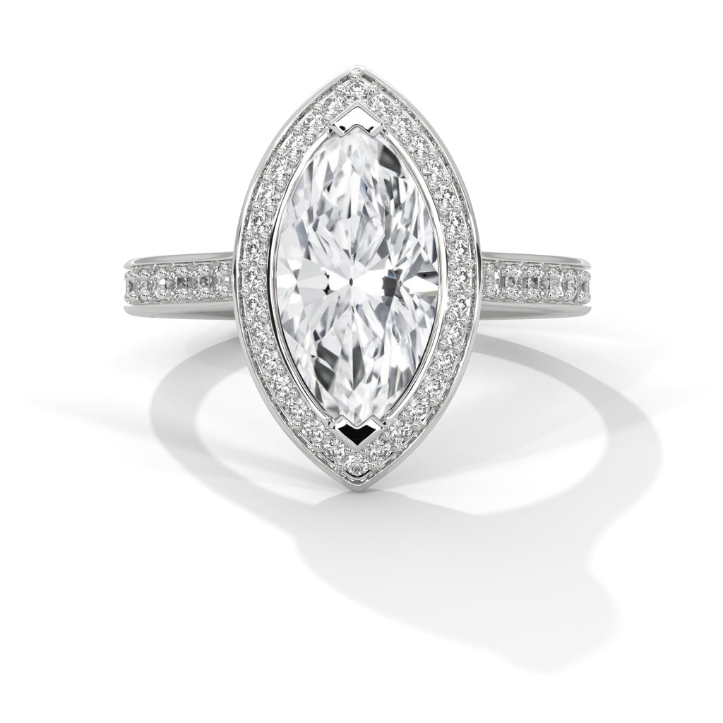Diamond ring with a marquise-shaped center stone on a white background