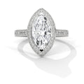 Diamond ring with a marquise-shaped center stone on a white background