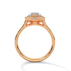 Rose gold ring with a diamond on a white background