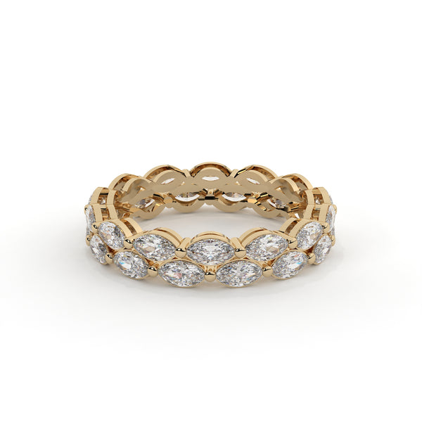 Gold ring with diamond stones on a white background