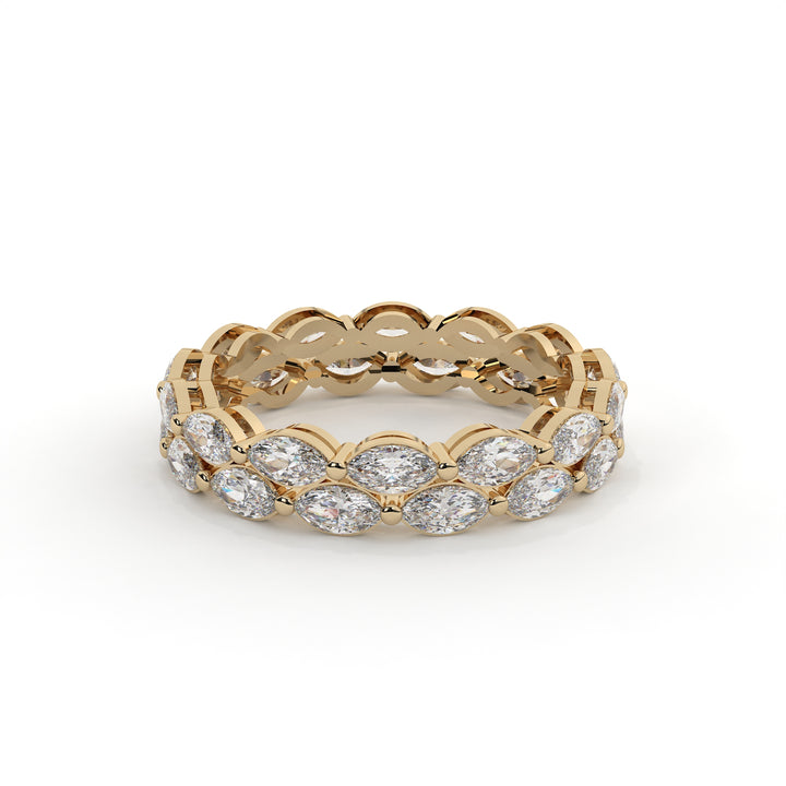 Gold ring with diamond stones on a white background