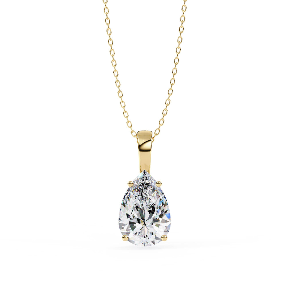 Gold necklace with a teardrop-shaped diamond pendant on a white background