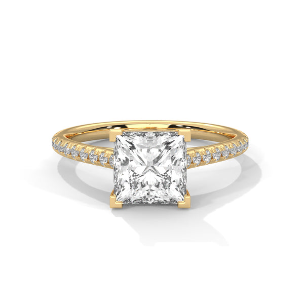 Gold ring with a large diamond and smaller diamonds on the band against a white background