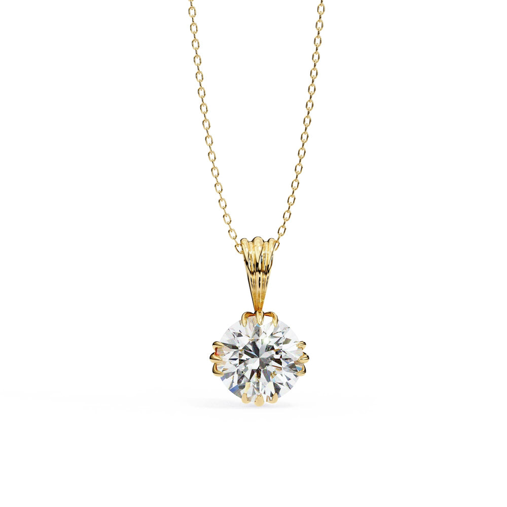 Gold necklace with a round diamond pendant on a white background