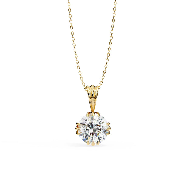 Gold necklace with a round diamond pendant on a white background