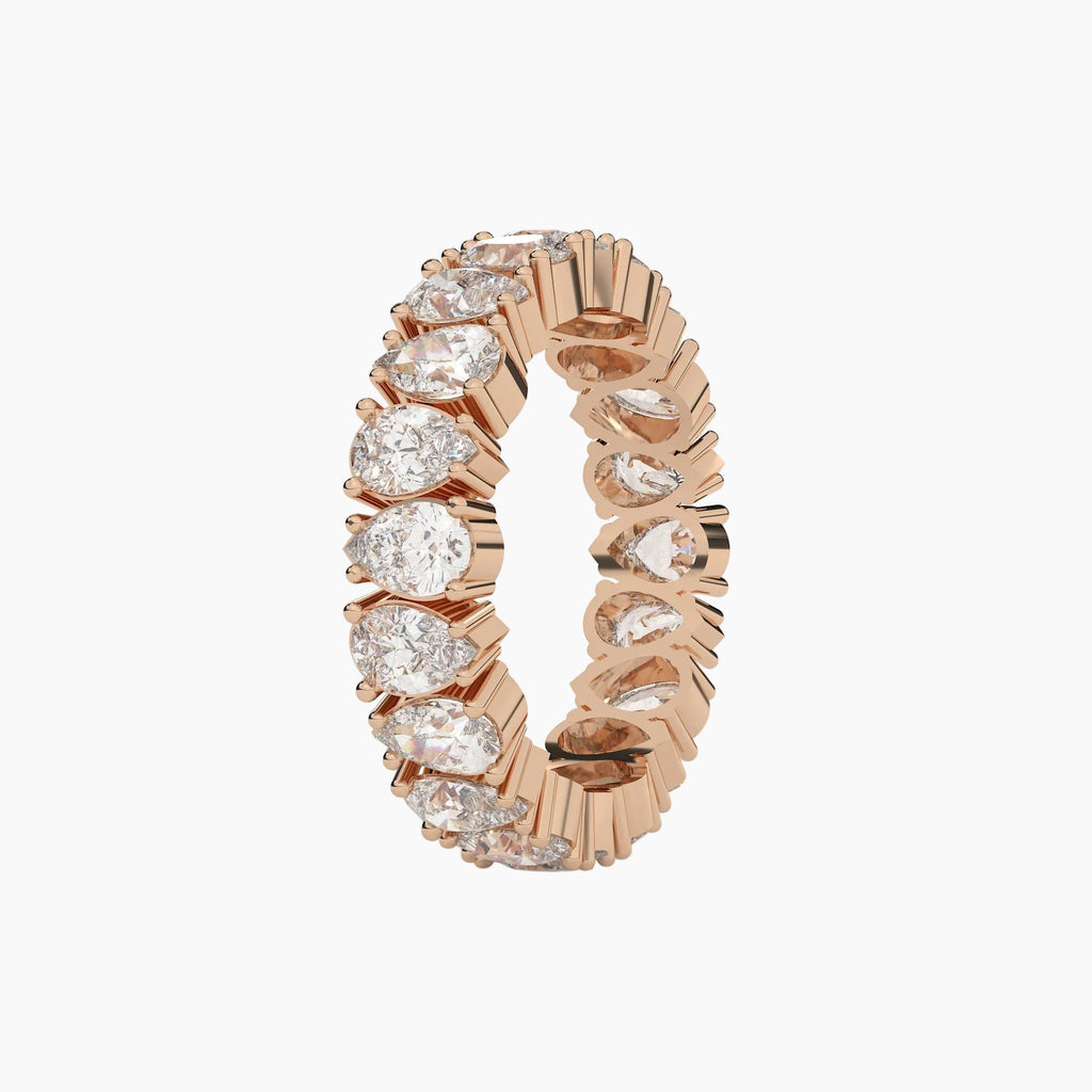 Rose gold ring with diamonds on a white background