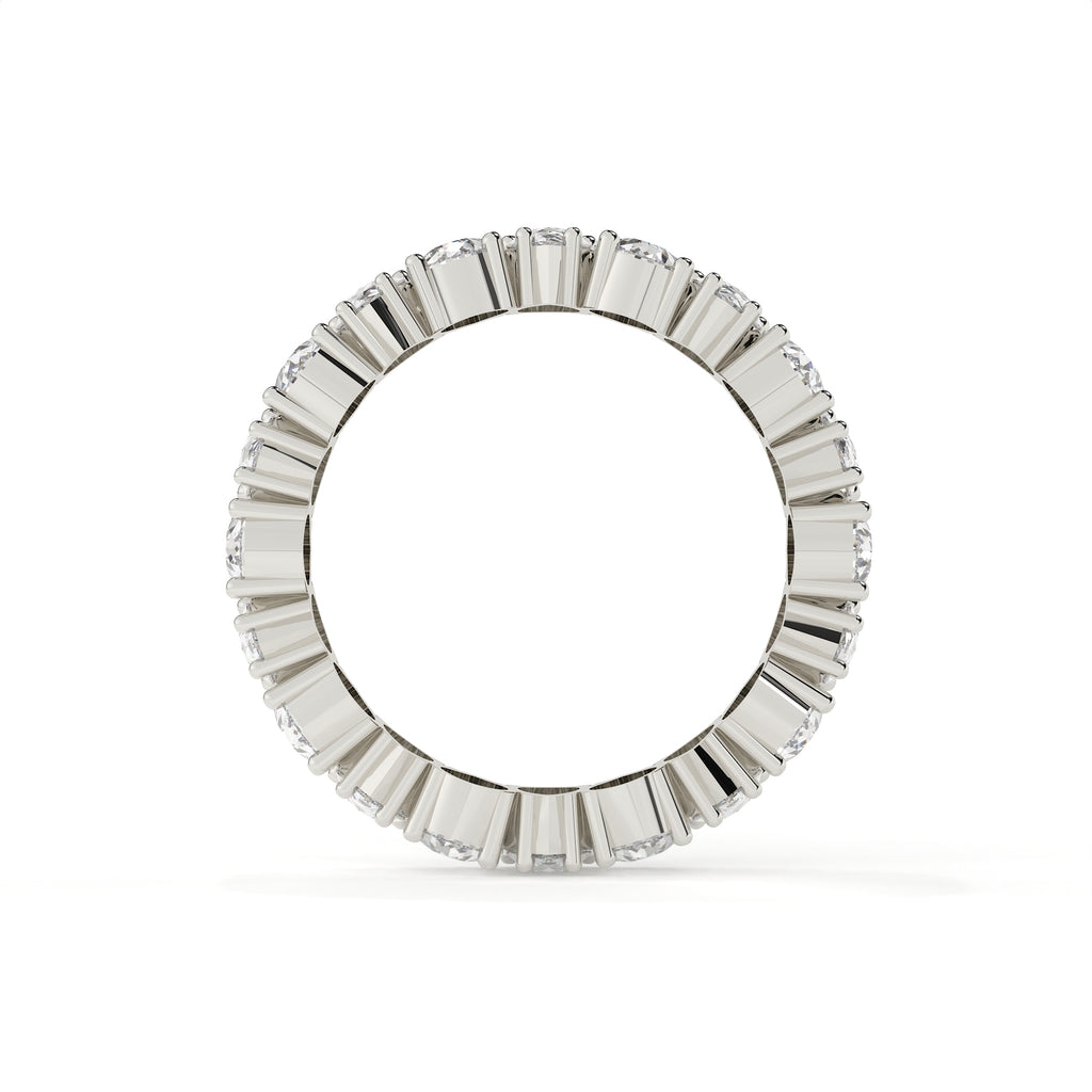 Silver ring with a diamond band on a white background