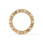 Gold ring with diamond accents on a white background