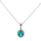 Silver necklace with a turquoise gemstone pendant on a white background