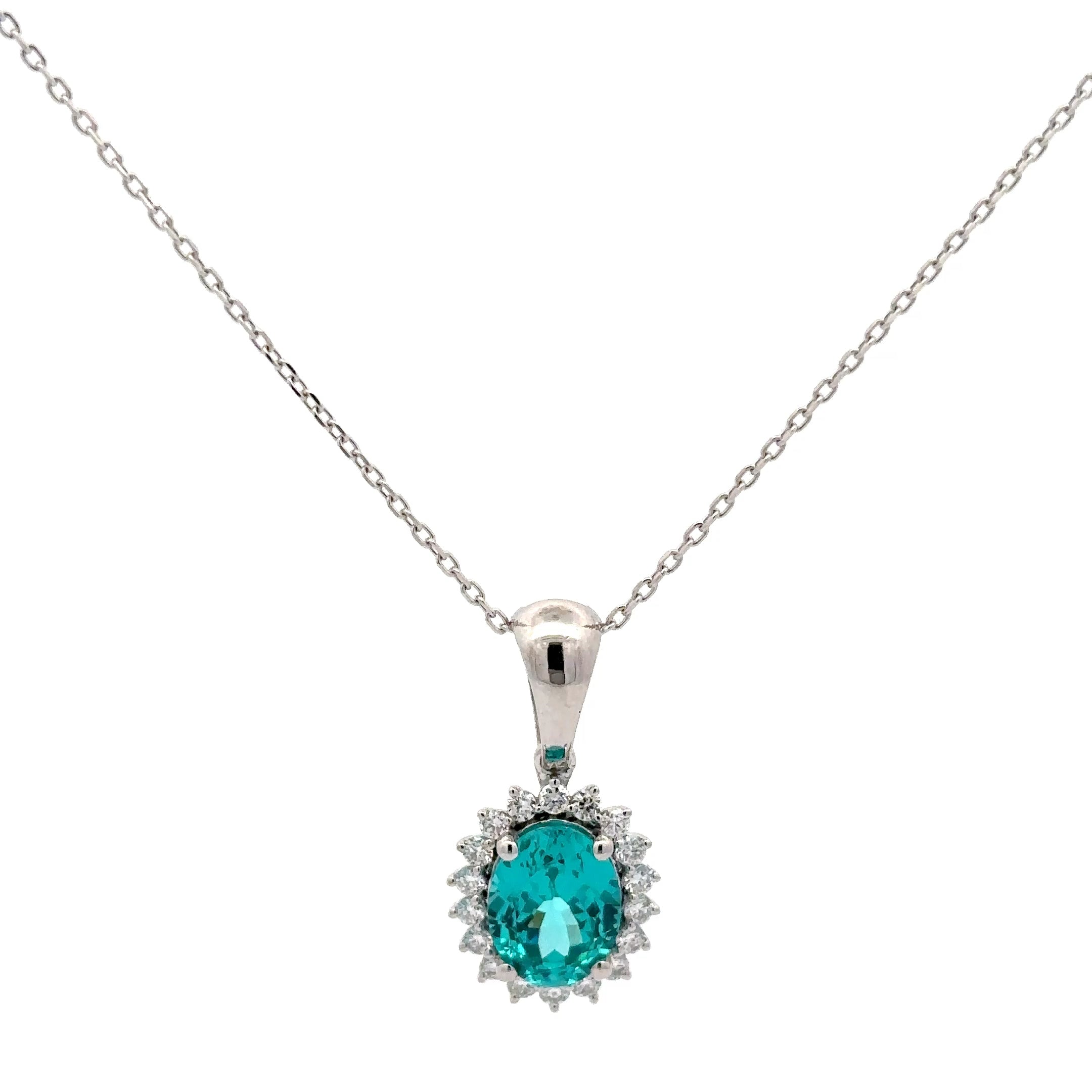 Silver necklace with a turquoise gemstone pendant on a white background