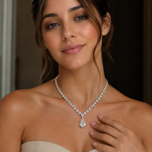 Woman wearing a diamond necklace with a blurred background