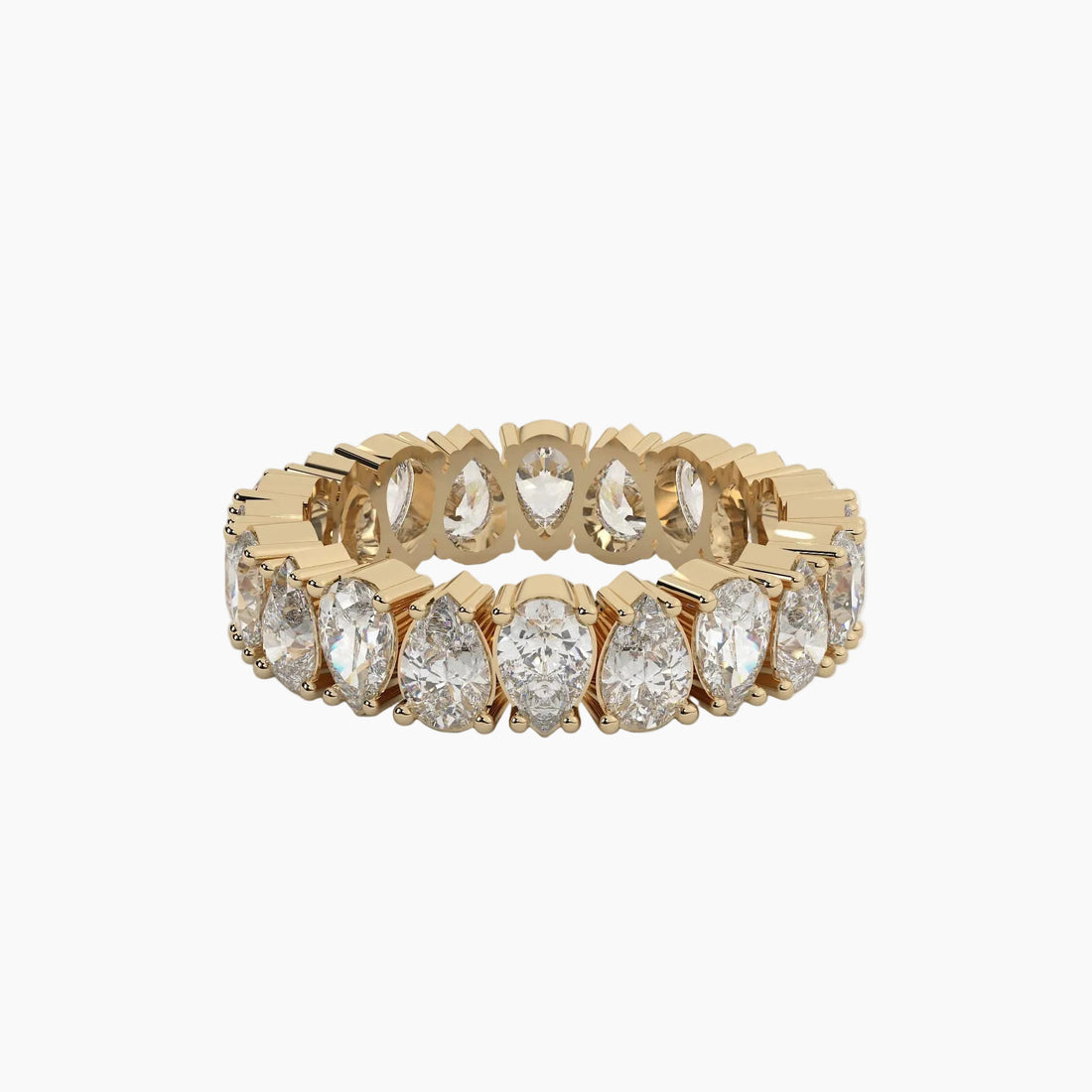 Gold ring with pear-shaped diamonds on a white background