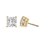 Gold stud earrings with clear gemstones on a white background